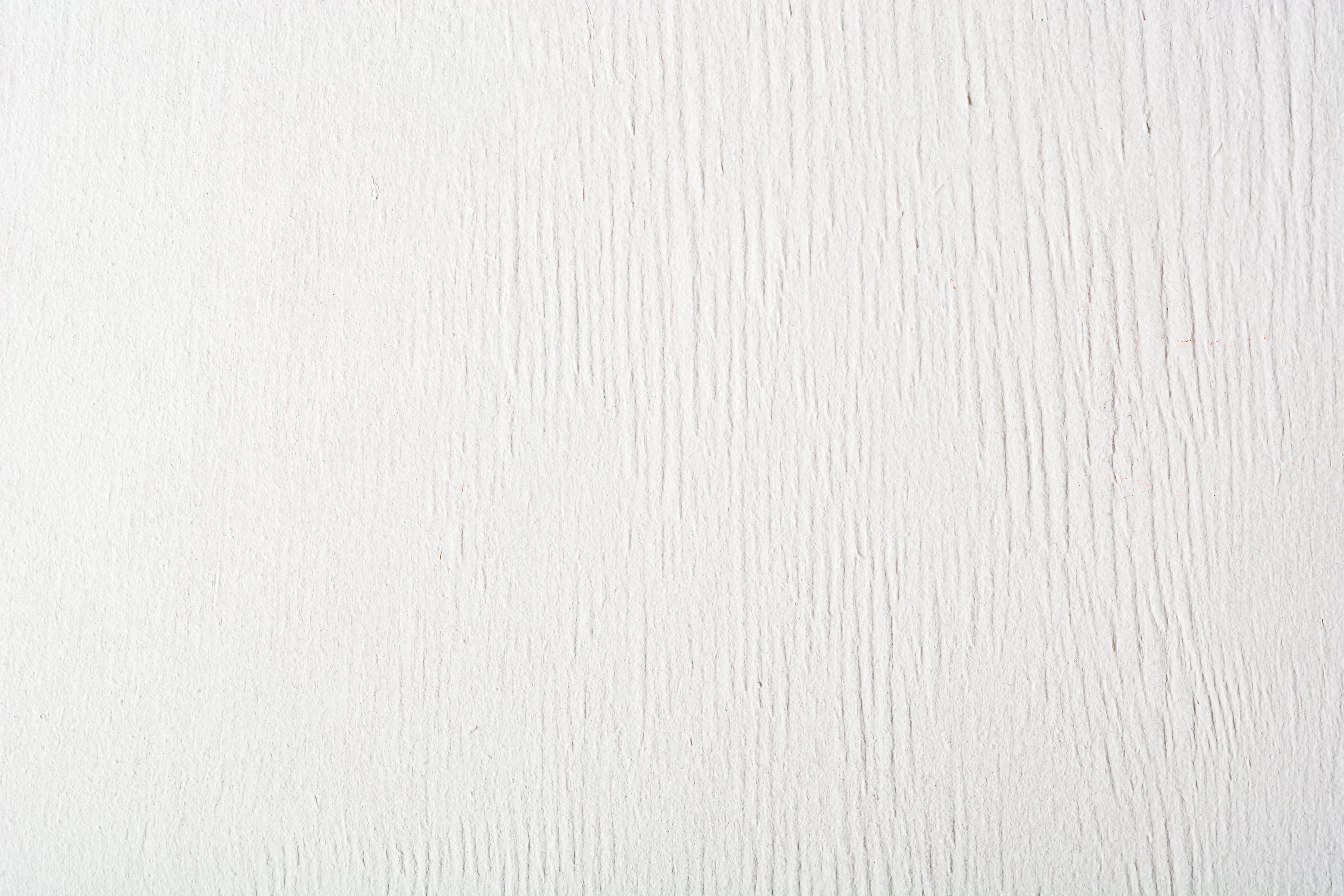 Textured wooden coating painted white matte paint. Background and texture for the designer.